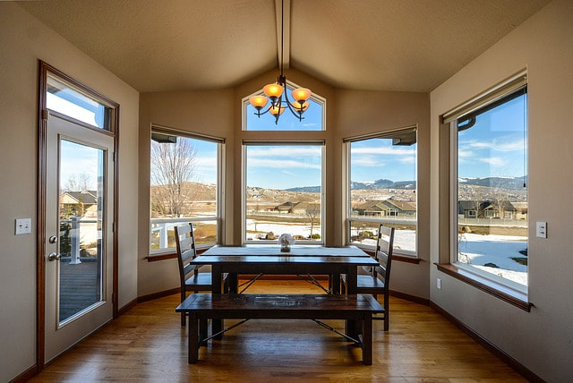 dining area with gray walls with a brown undertone