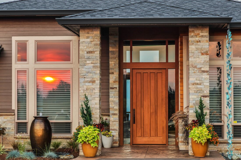 front image of house with orange wood and stone pillars