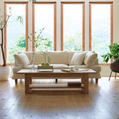 Beige Couch and oak table in living room setting