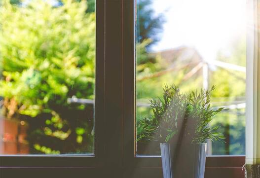 Picture of a window with sunrise shining through it
