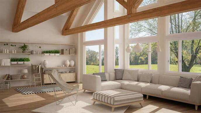 Open living room area with high beams and nice gray couch